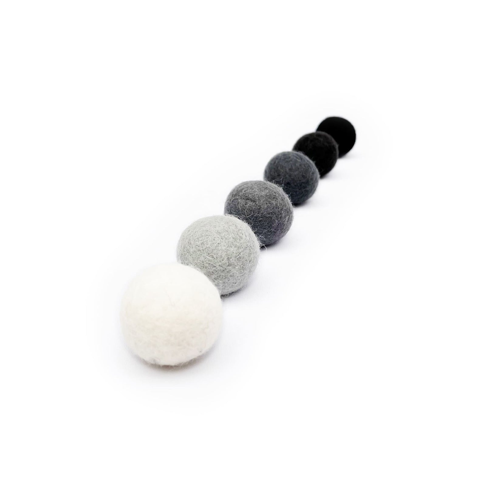 SHADES OF GREY felt balls in a colour gradient from white to black