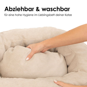 Herausnehmbares Kissen im beigen Cord-Katzenbett mit Text „Abziehbar & waschbar – für eine hohe Hygiene im Lieblingsbett deiner Katze